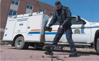  ?? CP FILE PHOTO ?? RCMP Cpl. Doug Green displays a drone outside Depot Division in Regina on April 19, 2018.