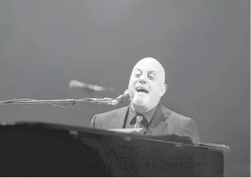  ?? Jon Shapley / Houston Chronicle ?? Billy Joel professed his love for Texas music while capturing the mature crowd Friday at the Toyota Center.