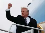  ??  ?? US PRESIDENT Donald Trump pumps his fist as he boards Air Force One on Friday.