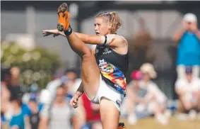  ??  ?? VICTORY: Tayla Harris kicks the ball. Picture: MICHAEL WILLSON/AFL MEDIA