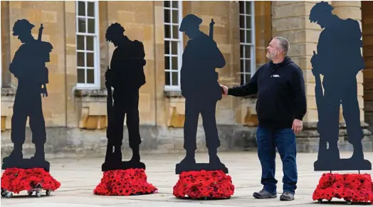  ?? ?? Years in the making: Creator Dan Barton with some of the silhouette­s at the send-off at Blenheim Palace yesterday
