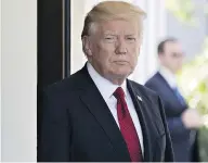  ?? ANDREW HARRER/BLOOMBERG ?? Donald Trump waits to greet Colombia’s President Juan Manuel Santos at the White House on Thursday.