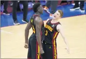  ?? MATT SLOCUM — THE ASSOCIATED PRESS ?? The Hawks’ Kevin Huerter, right, and Clint Capela celebrate during the final seconds of Game 7against the 76ers.