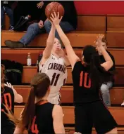  ??  ?? Kelseyvill­e’s Kasandra Villalobos defends on a shot by Clear Lake’s Sydney Howe as Allison Bryant (4) follows the action.