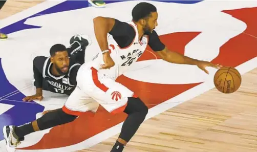  ?? AP ?? Toronto’s Norman Powell steals ball from Garrett Temple late in second half Wednesday, a play that helps seal win for Raptors.