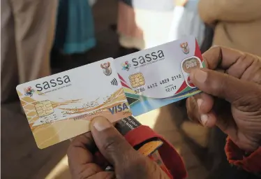  ?? | SIMPHIWE MBOKAZI | African News agency (ANA) Archives ?? The Sassa new and old cards. MPs were delighted to hear that Cash Paymaster Services would no longer be involved in teh payment of social grants.