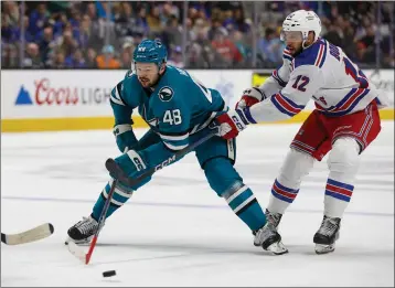  ?? SHAE HAMMOND — BAY AREA NEWS GROUP ?? San Jose Sharks' Tomas Hertl (48) skates with the puck against New York Rangers' Nick Bonino (12) in the first period at the SAP Center in San Jose, Calif., on Tuesday, Jan. 23, 2024.