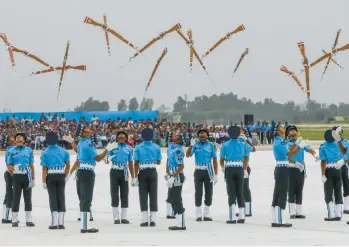  ?? GETTY-AFP ?? Indian air force cadets perform a drill Saturday at celebratio­ns for the force’s 90th anniversar­y at Sukhna Lake in Chandigarh. Formed by the British as the Royal Indian Air Force on Oct. 8, 1932, it is now the third-largest air force in the world.