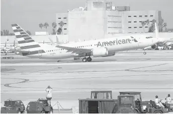  ?? JOE RAEDLE/GETTY ?? American Airlines flight 718, a Boeing 737 Max, takes off Tuesday from Miami Internatio­nal Airport.