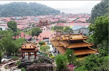  ??  ?? Worth the effort: It might take some time and effort, but climb up the stairs towards the back of Fu Lin Kong temple to gain access to a beautiful view of the island’s landscape.