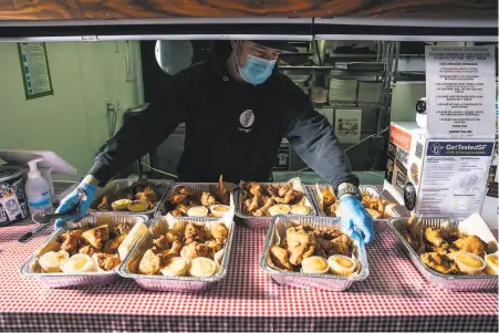  ??  ?? Top: Christian Ciscle (right), chefowner of SF Chickenbox, hands meals to a delivery person, part of a partnershi­p between Chickenbox and SF New Deal. Above: Ciscle with fried chicken that will be delivered to the elderly or less fortunate.