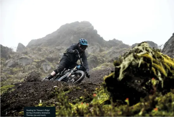  ??  ?? Heading for ‘Heaven’s Ridge’ during a thundery downpour, Thomas rips and roosts through the volcanic ash