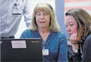  ??  ?? Sandra Delamater, lead data specialist, helps Drs. Theresa Ronan, right, and Stricks review data on patients with opioid addiction at Christus St. Vincent Regional Medical Center. Kathy Armijo Etre, the hospital’s vice president of mission, says there are 47 deaths for every 100,000 overdoses in Santa Fe County, surpassing the rate of 43 in New Mexico and 39 nationally.