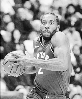  ?? JONATHAN HAYWARD THE CANADIAN PRESS ?? With two-time NBA defensive player of the year Kawhi Leonard aboard, the Toronto Raptors are about to pull back the curtain on what should be a compelling season. The Raptors open the regular season against the Cleveland Cavaliers on Wednesday.