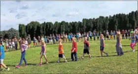  ?? SUBMITTED PHOTO — VANESSA SHERRER ?? Greenwich Elementary students create a human peace sign on Peace Day, Sept. 21.