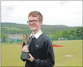  ??  ?? Luke Grattan with the Frances Plummer Cup for drama. 06_a25LHSawar­ds02