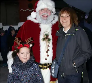  ??  ?? Robyn and Tara Byrne from Coolcotts with Santa at the switching on of the Christmas lights in Wexford.