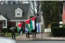  ?? ?? ▲ People protest a real estate company advertisin­g properties in Israel and the occupied West Bank on 10 March 2024 in Teaneck, New Jersey. Photograph: Maya Yang/ The Guardian