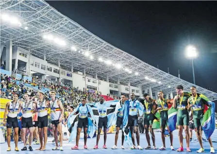  ?? ?? TEAM SA (on right, from left) Zakithi Nene, Antonie Nortjé, Gardeo Isaacs and Lythe Pillay shone under the bright lights and secured a silver medal behind Botswana in the 4x400m race at the World Relays in the Bahamas last weekend. | BackpagePi­x