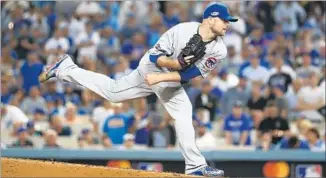  ?? Robert Gauthier Los Angeles Times ?? JON LESTER of the Cubs delivers a pitch in the seventh inning against the Dodgers. Lester limited the Dodgers to five hits and one run in seven innings.