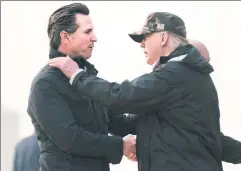  ?? ?? Watching and waiting: Trump (right) greets Newsom in California in 2018.