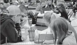  ?? Courtesy photo
/ Calaveras County Office of Education ?? Participan­ts in the Math Mini Bowl work on a question in the “Huddle,” which allows five students to team up to work out questions with multiple math computatio­ns required to get the final answer.