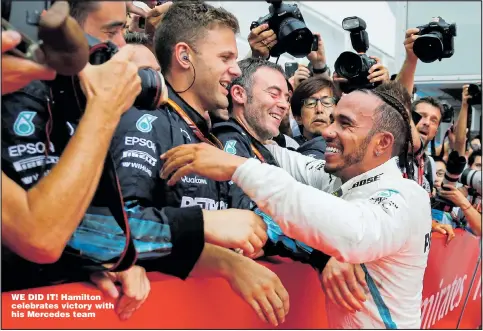  ?? Pictures: RALPH ORLOWSKI and ANDREJ ISAKOVIC ?? WE DID IT! Hamilton celebrates victory with his Mercedes team