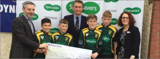  ??  ?? Pictured at the cheque presentati­on is Specsavers Drogheda store partners Kerril Hickey and Fiona O’Donnell together with team players from Boyne RFC Minis Scott Hickey, Andrew Breen, Adam Dooley, Alex Berney, and Club president Patrick Cunniffe.