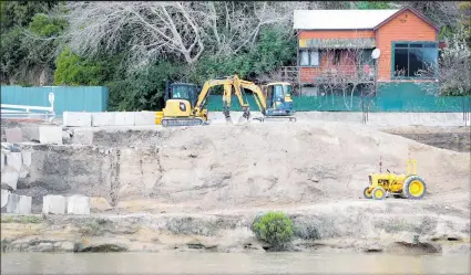  ??  ?? Roadworks to repair flood damage on SH4/Anzac Parade, outside the Red Lion.