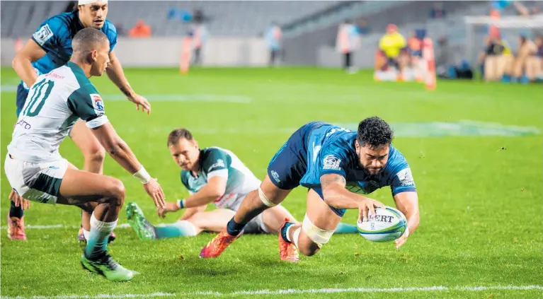  ?? Photo / Photosport ?? When Akira Ioane scored this late try off a five-metre scrum, victory looked with reach for the Blues, but the Bulls scored a late converted try of their own to earn a share of the points.