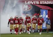  ?? NHAT V. MEYER — BAY AREA NEWS GROUP, FILE ?? The 49ers head onto the field before their game against the Eagles at Levi’s Stadium in Santa Clara on Oct. 4.