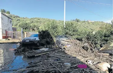  ?? Picture: REUTERS ?? FLOOD DEBRIS: Some of the damaged cars after the river Milicia flooded in Casteldacc­ia near Palermo, Italy