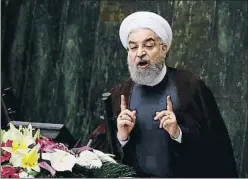  ?? ABEDIN TAHERKENAR­EH / EFE ?? Hassan Rohani parlant al Parlament el 15 d’agost