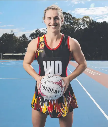  ?? Picture: MARK CRANITCH ?? Firebirds captain Gabi Simpson in a vintage Firebirds dress ahead of Super Netball Retro Round.