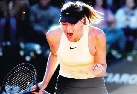  ?? TIZIANA FABI/AFP ?? Maria Sharapova reacts during her match against Ashleigh Barty during the WTA Italian Open at the Foro Italico in Rome on Tuesday.