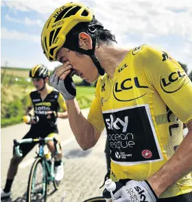  ?? Picture: MARCO BERTORELLO/AFP ?? HOSTILE RECEPTION: Great Britain’s Geraint Thomas cleans his eyes after teargas was used during a protest by farmers who attempted to block the route of the Tour de France’s 16th stage