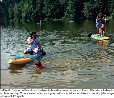  ??  ?? LaFayette Recreation Department held paddle boarding demonstrat­ions at Queen City Lake in LaFayette on Tuesday, July 25, as a means of expanding recreation­al activities for citizens in the city. (Messenger photo/Josh O’Bryant)