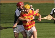  ??  ?? Ian Hawkins under pressure from Fethard’s Garrett Foley.