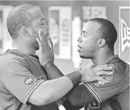  ??  ?? Jean Segura (right) has fun with Diamondbac­ks teammate Yasmany Tomas after Tomas hit his second home run of the game Wednesday night.