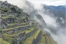  ??  ?? Clouds and mist add to Machu Picchu’s mystique on many mornings.