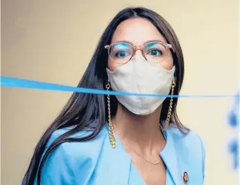  ?? TOMWILLIAM­S/GETTY ?? Alexandria Ocasio-Cortez, D-N.Y., arrives for a hearing before the House Oversight and Reform Committee on Aug. 24 in Washington, D.C. The 31-year-old has received a COVID-19 vaccine and that has sparked criticism.