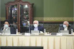 ?? (Official Presidenti­al Website/Handout via Reuters) ?? IRANIAN FOREIGN Minister Javad Zarif wears a face mask during a cabinet meeting in Tehran yesterday.