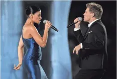  ??  ?? Canadians Nelly Furtado and Bryan Adams aimed high with “Bang the Drum” in Vancouver in 2010. ADRIAN DENNIS/ AFP/GETTY IMAGES