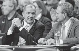  ?? ROBERT WILLETT rwillett@newsobserv­er.com ?? ACC Commission­er Jim Phillips talks with North Carolina Athletic Director Bubba Cunningham during the NCAA Tournament game between North Carolina and Duke at Caesars Superdome in New Orleans on April 2, 2022.