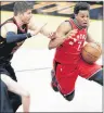  ?? AP PHOTO ?? Toronto Raptors point guard Kyle Lowry, right, drives past Cleveland Cavaliers guard Kyle Korver during Saturday’s game in Cleveland.