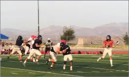  ?? Dan Lovi/The Signal ?? Weston Eget looks down-field in a scrimmage at West Ranch on Friday, Aug. 10. Weston has thrown for 1,300 yards and 13 touchdowns so far in 2018.