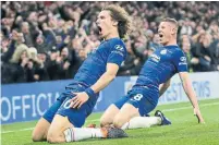  ?? TIM IRELAND THE ASSOCIATED PRESS ?? Chelsea’s David Luiz, left, celebrates his goal that sealed a 2-0 win against previously unbeaten Manchester City on Saturday.