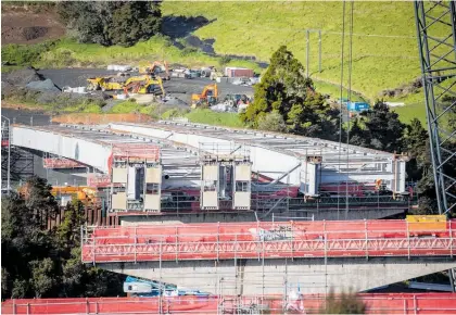  ?? Photo / Michael Craig ?? Officially named Ara Tu¯hono, or “connecting path”, the motorway has faced delays and cost overruns.