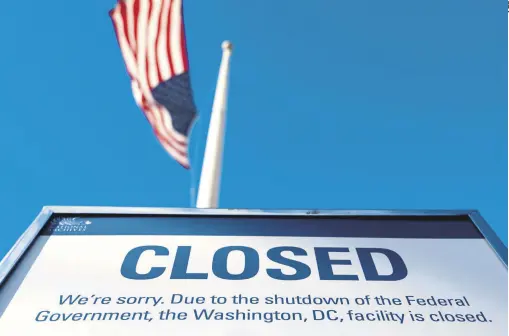  ??  ?? A sign is displayed on a government building that is closed because of a U.S. government shutdown, in Washington, D.C., Dec. 22.