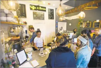  ?? Michael Cummo / Hearst Connecticu­t Media ?? Customers place their orders at the counter inside Lorca coffee shop at 125 Bedford St. in downtown Stamford on Thursday.